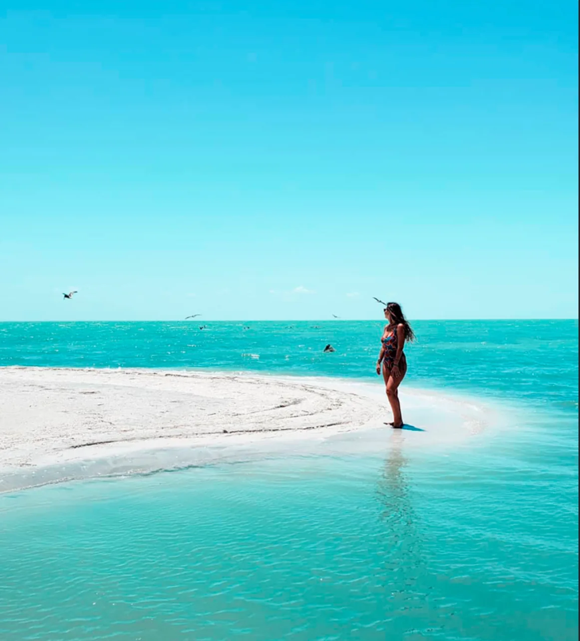 Visitor enjoying a white sandbar