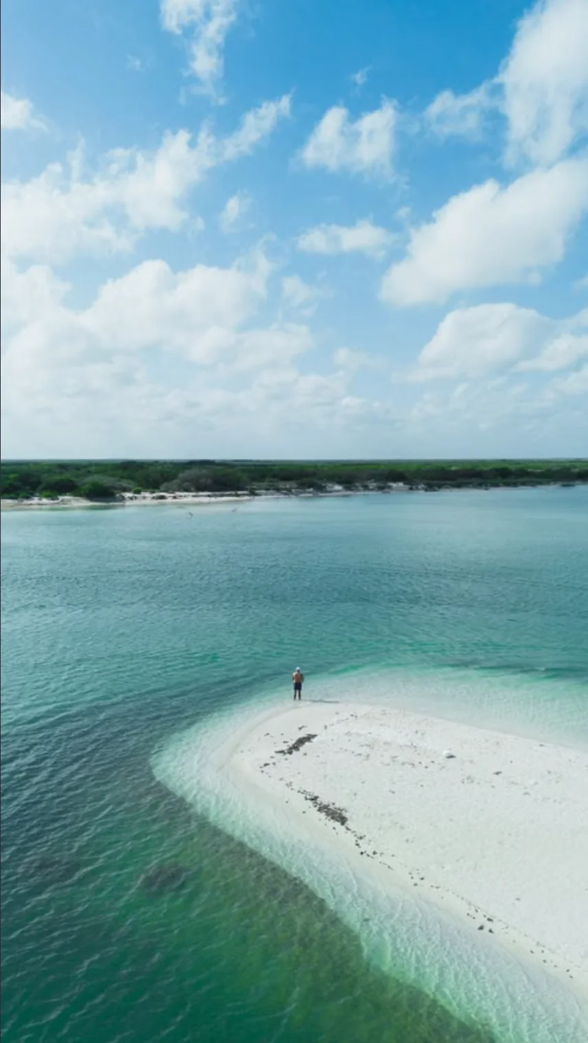 White sandbar and calm waters seen from above